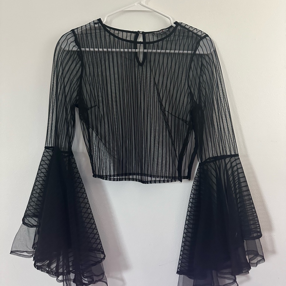 Gorgeous black see through top with long flare sleeves.